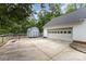 Backyard featuring a detached garage, basketball hoop, and a shed at 406 Brentwood Cir, Kannapolis, NC 28081