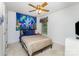 Cozy bedroom with a ceiling fan, window, and a colorful tapestry at 406 Brentwood Cir, Kannapolis, NC 28081