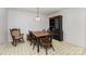 Dining room features a traditional table with seating, a black hutch, and patterned flooring at 406 Brentwood Cir, Kannapolis, NC 28081