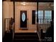 Inviting front entrance with a decorative door and well-lit porch, creating a warm and welcoming ambiance at 406 Brentwood Cir, Kannapolis, NC 28081