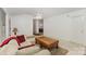 Cozy living room boasts vaulted ceilings, neutral carpet, and natural light with comfortable seating at 406 Brentwood Cir, Kannapolis, NC 28081