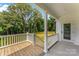 Covered back porch with wooden floor at 418 W Westview St, Gastonia, NC 28052