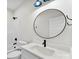 Bathroom featuring modern round mirror and contemporary fixtures at 418 W Westview St, Gastonia, NC 28052