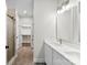 Bathroom featuring a double vanity, walk-in closet, and a walk-in shower at 418 W Westview St, Gastonia, NC 28052