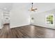 Spacious bedroom with hardwood floors, vaulted ceiling, and ample natural light from two large windows at 418 W Westview St, Gastonia, NC 28052