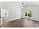 Bright bedroom with a vaulted ceiling, ceiling fan, wooden flooring, and a large window at 418 W Westview St, Gastonia, NC 28052