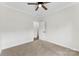 Bedroom with carpet, ceiling fan, and an open door at 418 W Westview St, Gastonia, NC 28052