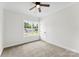 Bedroom with carpet, ceiling fan, and window at 418 W Westview St, Gastonia, NC 28052