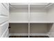 Walk-in closet with shelves and rods, providing ample storage space at 418 W Westview St, Gastonia, NC 28052