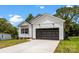 Charming exterior featuring a two-car garage, light blue front door, manicured lawn and craftsman-style details at 418 W Westview St, Gastonia, NC 28052