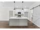 Bright kitchen with a large kitchen island, modern light fixtures, and stainless steel appliances at 418 W Westview St, Gastonia, NC 28052