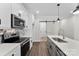 Modern kitchen showcasing stainless steel appliances, sleek countertops, and stylish backsplash at 418 W Westview St, Gastonia, NC 28052