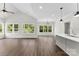 Bright living room featuring hardwood floors, many windows, high ceilings and neutral wall colors at 418 W Westview St, Gastonia, NC 28052