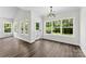 Living room with lots of windows bringing in natural light and wooden flooring at 418 W Westview St, Gastonia, NC 28052
