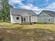 View of backyard showing the home's rear porch and a neighboring building at 420 Fulton Dr, Kings Mountain, NC 28086