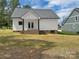 View of backyard showing the home's rear porch and a neighboring building at 420 Fulton Dr, Kings Mountain, NC 28086