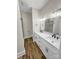 Modern bathroom featuring double vanity with white cabinetry, quartz countertop, and a glass-enclosed marble shower at 420 Fulton Dr, Kings Mountain, NC 28086