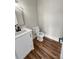Bathroom featuring a toilet, wooden floors, and a single vanity with white cabinetry at 420 Fulton Dr, Kings Mountain, NC 28086