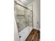 Shower with marble tiling, glass enclosure, with a built in niche and wooden floors at 420 Fulton Dr, Kings Mountain, NC 28086