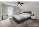 Styled bedroom featuring carpet floors, a ceiling fan, and a blue bed at 420 Fulton Dr, Kings Mountain, NC 28086