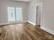 Bedroom featuring wood-look flooring, a window, and neutral-colored walls at 420 Fulton Dr, Kings Mountain, NC 28086