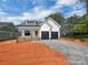 Charming two-story home with a yellow door and a two-car garage at 420 Fulton Dr, Kings Mountain, NC 28086