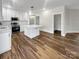 Well-lit kitchen with white cabinets, stainless steel appliances, and a center island at 420 Fulton Dr, Kings Mountain, NC 28086