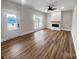 Spacious living room with wood-look flooring, a ceiling fan, and a fireplace at 420 Fulton Dr, Kings Mountain, NC 28086