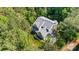 Aerial view highlights a charming home with its well-manicured lawn, complemented by mature trees and surroundings at 4290 Palm Dr, Denver, NC 28037