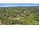 Expansive aerial view of a house nestled within a forest, surrounded by nature and serene landscape at 4290 Palm Dr, Denver, NC 28037