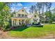 Charming home featuring a well-maintained lawn, inviting front porch, and tasteful landscaping at 4290 Palm Dr, Denver, NC 28037