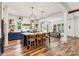 Open-concept kitchen with large island, stylish lighting, and hardwood floors at 4290 Palm Dr, Denver, NC 28037