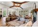Spacious open-concept living room with comfortable seating, a fireplace, and hardwood floors for a welcoming space at 4290 Palm Dr, Denver, NC 28037