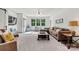 Spacious living room with large windows, plush carpeting, and comfortable seating at 4290 Palm Dr, Denver, NC 28037
