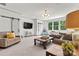 Bright living room featuring a large window, stylish decor, sliding doors and comfortable seating area at 4290 Palm Dr, Denver, NC 28037