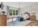 Bright main bedroom showcases hardwood floors, stylish decor, a large window and ample natural light at 4290 Palm Dr, Denver, NC 28037