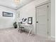 Bright office with a modern desk, carpet, and natural light at 4290 Palm Dr, Denver, NC 28037