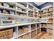 Well-organized pantry featuring white shelving, baskets, and ample storage space at 4290 Palm Dr, Denver, NC 28037