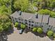 Aerial view showcases the building's design and well-maintained landscaping with ample parking space at 430 Queens Rd # 111, Charlotte, NC 28207
