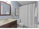 Bathroom featuring a vanity with a sink and a shower with a curtain at 430 Queens Rd # 111, Charlotte, NC 28207