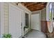 The entryway features two doors and is adorned with plants and brick accents, adding charm at 430 Queens Rd # 111, Charlotte, NC 28207