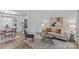 Living room and dining area featuring modern decor, including a stylish rug and neutral color palette at 430 Queens Rd # 111, Charlotte, NC 28207