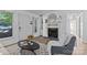 Bright living room with a fireplace, neutral decor, and a cozy seating area, perfect for relaxation at 430 Queens Rd # 111, Charlotte, NC 28207