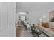 Sunlit living room flowing into a dining area, complete with stylish furnishings and modern decor at 430 Queens Rd # 111, Charlotte, NC 28207
