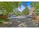 Street view of the community featuring brick sidewalks, mature trees, and multiple car parking at 430 Queens Rd # 111, Charlotte, NC 28207