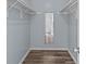 Walk-in closet with hardwood floors and natural light at 430 Queens Rd # 111, Charlotte, NC 28207