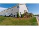 A well-maintained backyard with a small patio and lush greenery with mulch at 4312 Plumeria Way, Fort Mill, SC 29707