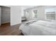 Bright bedroom features wood floors, a queen size bed, and a grey baby crib at 4312 Plumeria Way, Fort Mill, SC 29707