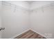 Walk-in closet with wooden floor and wire shelving for organizing your wardrobe at 4312 Plumeria Way, Fort Mill, SC 29707