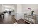 Elegant entryway with wood floors, decorative molding, and a mirrored accent table with an orchid at 4312 Plumeria Way, Fort Mill, SC 29707